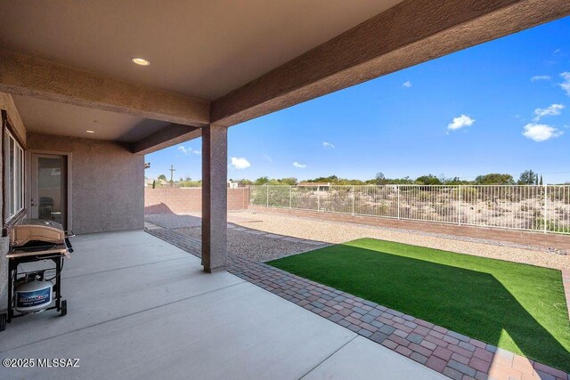 7956 S Desert Indigo Dr, Tucson, AZ 85747 - fenced backyard featuring a patio and area for grilling