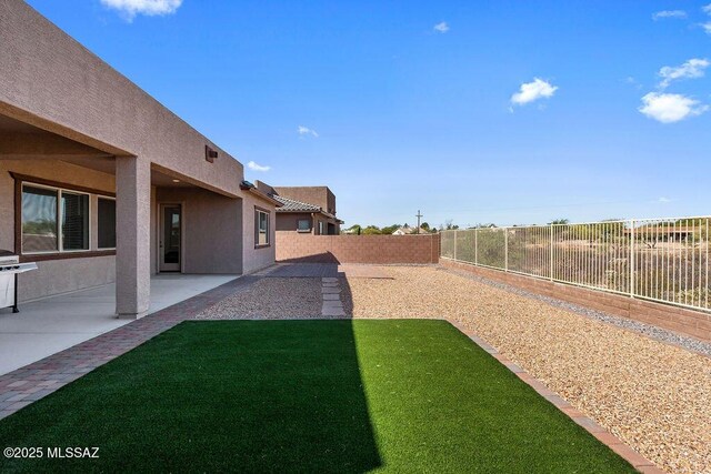 7956 S Desert Indigo Dr, Tucson, AZ 85747 - fenced backyard featuring a patio