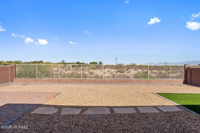 7956 S Desert Indigo Dr, Tucson, AZ 85747 - fenced backyard featuring a mountain view