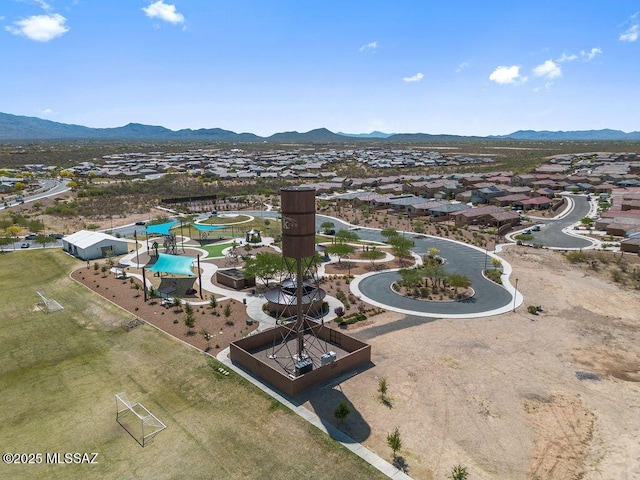 drone / aerial view featuring a residential view and a mountain view