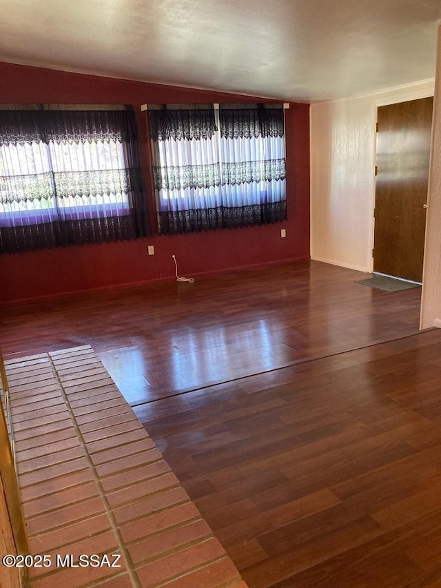 spare room featuring hardwood / wood-style flooring