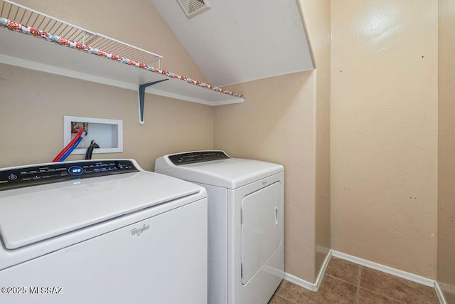 clothes washing area with laundry area, tile patterned flooring, baseboards, visible vents, and washer and clothes dryer