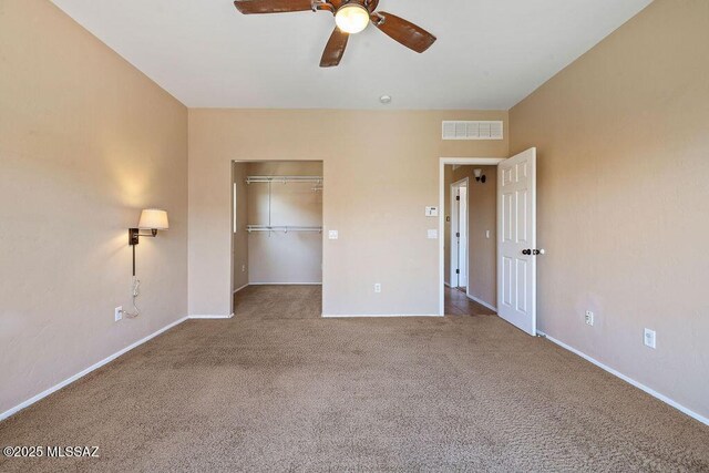 448 E Placita Nodo, Sahuarita, AZ 85629 - unfurnished bedroom with carpet flooring, baseboards, visible vents, and a spacious closet