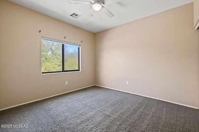 carpeted empty room with ceiling fan, visible vents, and baseboards