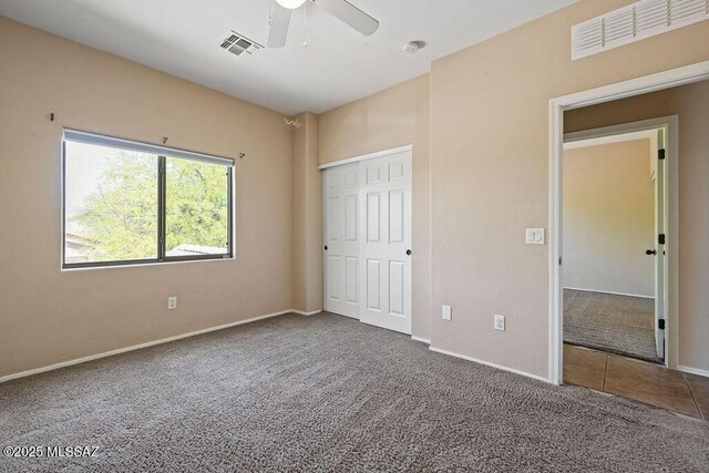 448 E Placita Nodo, Sahuarita, AZ 85629 - unfurnished bedroom with baseboards, visible vents, and carpet