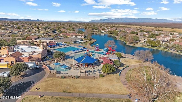 bird's eye view with a water and mountain view