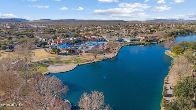 aerial view with a water and mountain view and a residential view