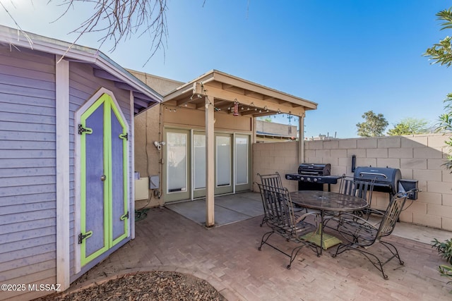 1734 N Van Buren Ave, Tucson, AZ 85712 - view of patio / terrace featuring fence and a grill