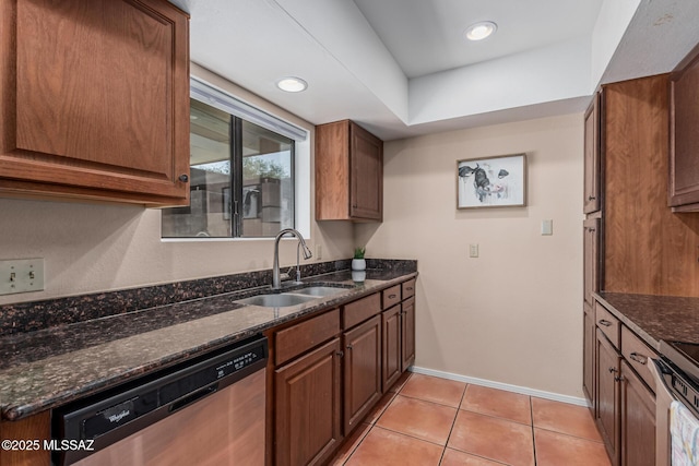 1734 N Van Buren Ave, Tucson, AZ 85712 - kitchen featuring baseboards, a sink, dark stone countertops, appliances with stainless steel finishes, and light tile patterned floors