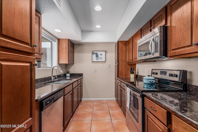 1734 N Van Buren Ave, Tucson, AZ 85712 - kitchen featuring a sink, appliances with stainless steel finishes, recessed lighting, and dark stone counters