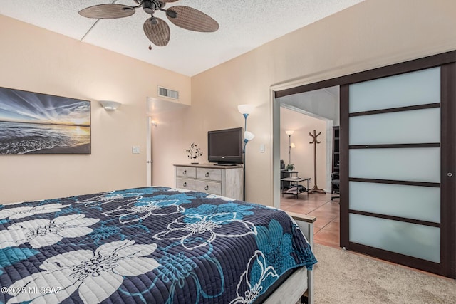 1734 N Van Buren Ave, Tucson, AZ 85712 - bedroom featuring a ceiling fan, a textured ceiling, visible vents, and light tile patterned floors