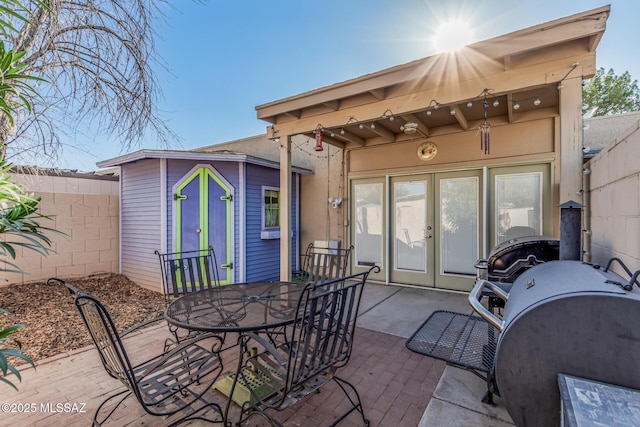 1734 N Van Buren Ave, Tucson, AZ 85712 - view of patio with fence, french doors, and outdoor dining space