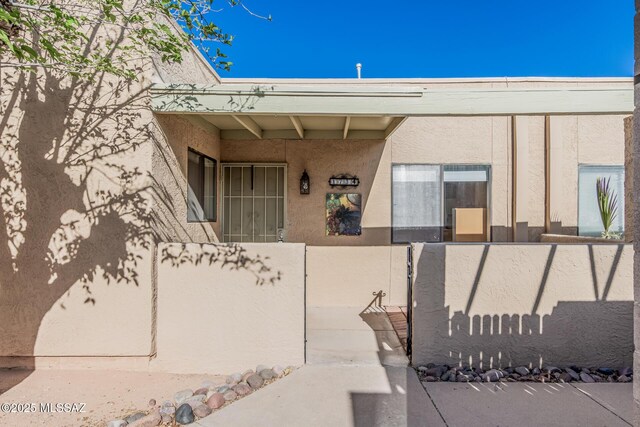 1734 N Van Buren Ave, Tucson, AZ 85712 - entrance to property with stucco siding and fence