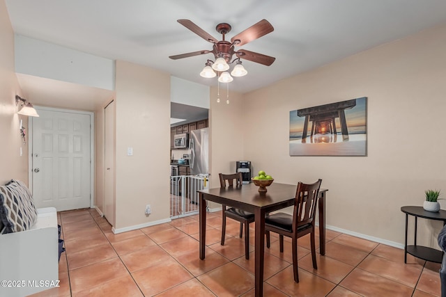 1734 N Van Buren Ave, Tucson, AZ 85712 - dining room featuring light tile patterned flooring, ceiling fan, and baseboards