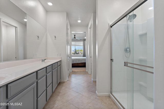 10337 S Pantano Knolls Dr, Vail, AZ 85641 - ensuite bathroom with baseboards, tile patterned floors, a stall shower, and ensuite bath