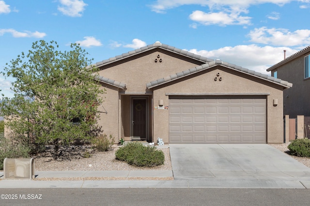 10337 S Pantano Knolls Dr, Vail, AZ 85641 - ranch-style house with concrete driveway, a tiled roof, an attached garage, and stucco siding