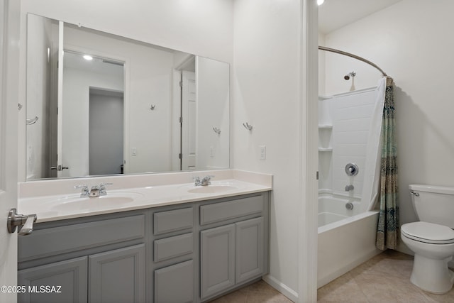 10337 S Pantano Knolls Dr, Vail, AZ 85641 - bathroom with double vanity, toilet, tile patterned floors, and a sink