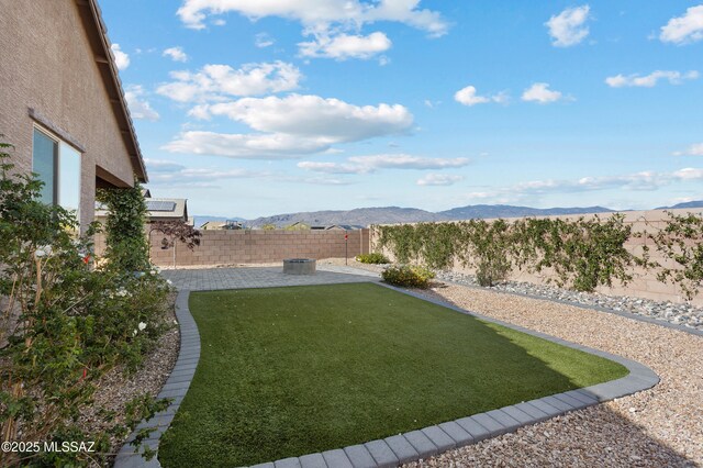 10337 S Pantano Knolls Dr, Vail, AZ 85641 - view of yard featuring a fenced backyard, a mountain view, and a patio area
