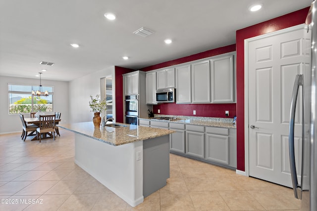 10337 S Pantano Knolls Dr, Vail, AZ 85641 - kitchen featuring a sink, appliances with stainless steel finishes, light tile patterned floors, and visible vents