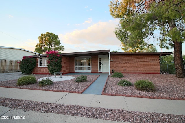 8133 E Colette Pl, Tucson, AZ 85710 - ranch-style home featuring brick siding and fence