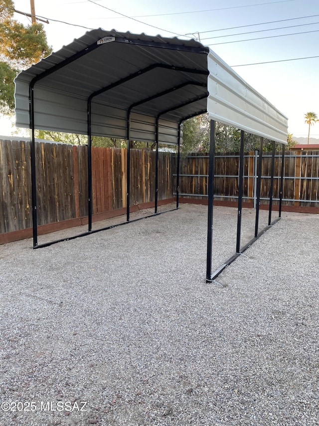 8133 E Colette Pl, Tucson, AZ 85710 - view of vehicle parking with a detached carport and fence