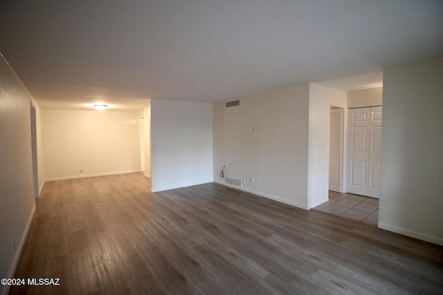 8133 E Colette Pl, Tucson, AZ 85710 - spare room with visible vents, baseboards, and wood finished floors