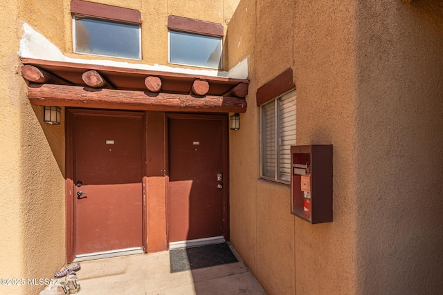 1810 E Blacklidge Dr Apt 827, Tucson, AZ 85719 - doorway to property with stucco siding