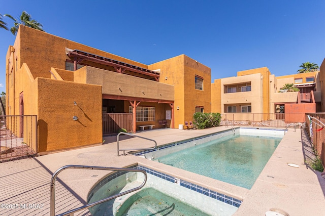 1810 E Blacklidge Dr Apt 827, Tucson, AZ 85719 - community pool featuring fence, a hot tub, and a patio area