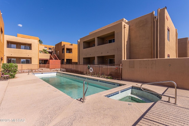 1810 E Blacklidge Dr Apt 827, Tucson, AZ 85719 - pool featuring a community hot tub, a patio area, and fence