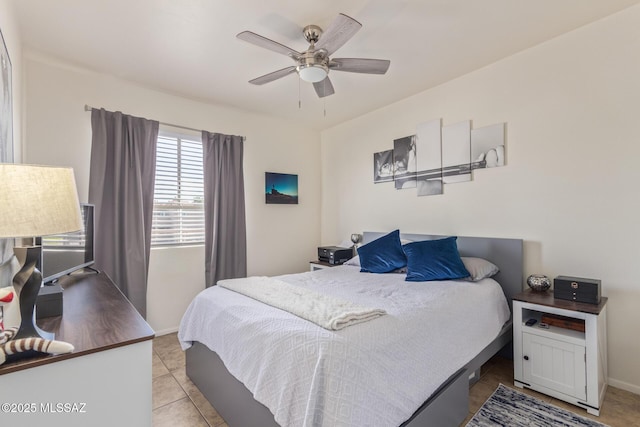 1810 E Blacklidge Dr Apt 827, Tucson, AZ 85719 - bedroom featuring baseboards, a ceiling fan, and light tile patterned floors