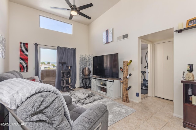 1810 E Blacklidge Dr Apt 827, Tucson, AZ 85719 - tiled living area featuring a ceiling fan, a high ceiling, visible vents, and baseboards