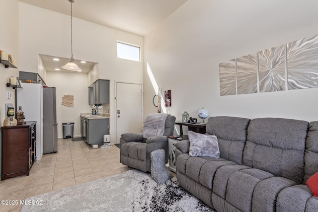 1810 E Blacklidge Dr Apt 827, Tucson, AZ 85719 - living room featuring light tile patterned floors and high vaulted ceiling
