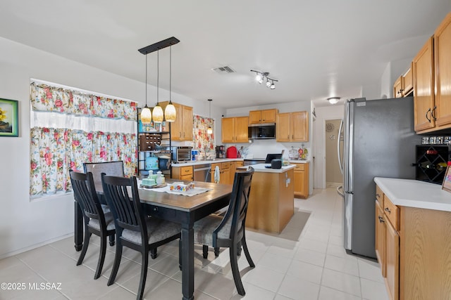 8014 S Wild Primrose Ave, Tucson, AZ 85747 - dining room with light tile patterned floors, baseboards, a toaster, and visible vents