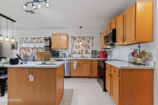 8014 S Wild Primrose Ave, Tucson, AZ 85747 - kitchen featuring visible vents, light countertops, a sink, appliances with stainless steel finishes, and hanging light fixtures