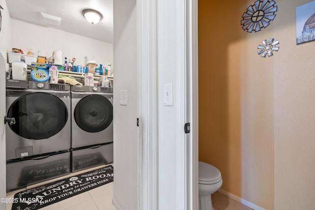 8014 S Wild Primrose Ave, Tucson, AZ 85747 - washroom with tile patterned flooring, laundry area, and washing machine and dryer