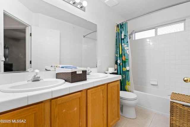 8014 S Wild Primrose Ave, Tucson, AZ 85747 - full bathroom featuring double vanity, shower / bath combination with curtain, tile patterned flooring, a sink, and toilet