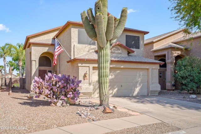8014 S Wild Primrose Ave, Tucson, AZ 85747 - mediterranean / spanish-style house with fence, an attached garage, concrete driveway, and stucco siding