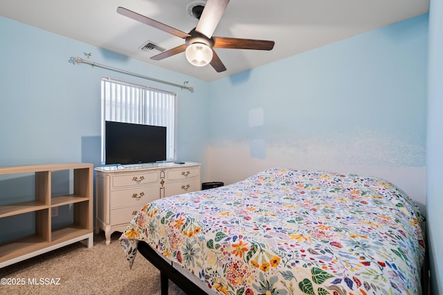 8014 S Wild Primrose Ave, Tucson, AZ 85747 - bedroom with light colored carpet, ceiling fan, and visible vents