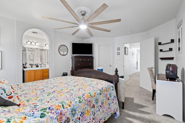 8014 S Wild Primrose Ave, Tucson, AZ 85747 - carpeted bedroom with ceiling fan, visible vents, and ensuite bathroom