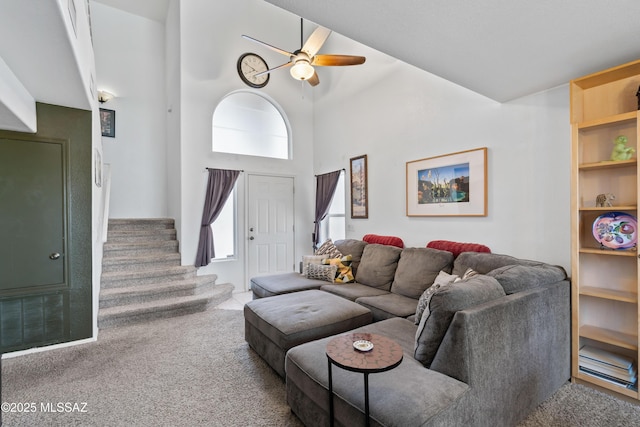 8014 S Wild Primrose Ave, Tucson, AZ 85747 - living room featuring stairway, high vaulted ceiling, carpet, and a ceiling fan