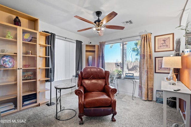 8014 S Wild Primrose Ave, Tucson, AZ 85747 - sitting room featuring carpet floors, ceiling fan, visible vents, and baseboards