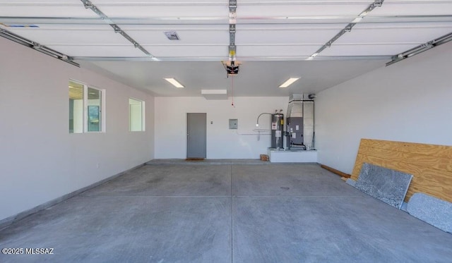 4270 E Broadway Blvd, Tucson, AZ 85711 - garage with a garage door opener, heating unit, and water heater