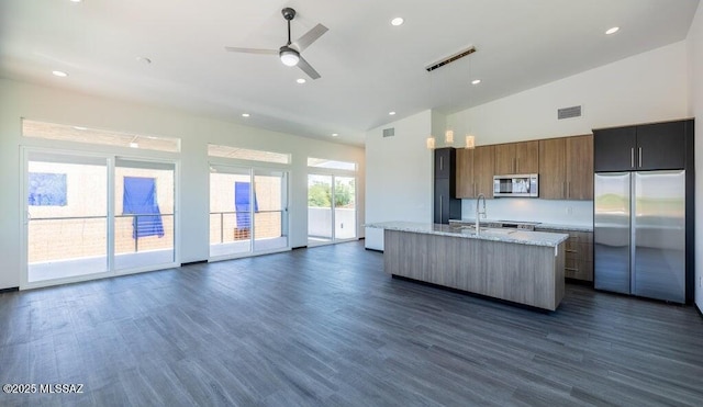 4270 E Broadway Blvd, Tucson, AZ 85711 - kitchen featuring a ceiling fan, visible vents, a center island with sink, dark wood-style floors, and stainless steel appliances