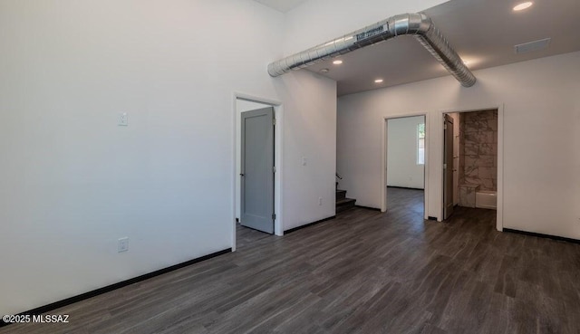 4270 E Broadway Blvd, Tucson, AZ 85711 - spare room featuring visible vents, stairs, baseboards, dark wood-style floors, and recessed lighting