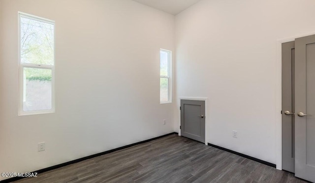 4270 E Broadway Blvd, Tucson, AZ 85711 - empty room with wood finished floors and a healthy amount of sunlight