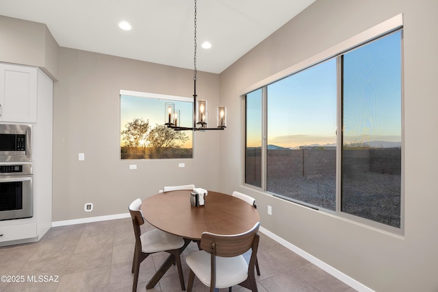dining area with an inviting chandelier, recessed lighting, baseboards, and light tile patterned floors