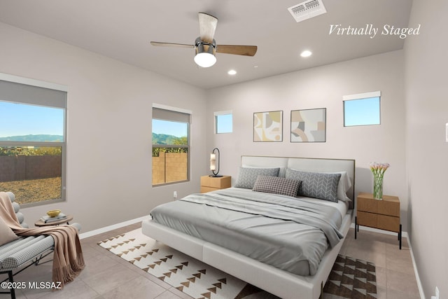 bedroom featuring tile patterned floors, multiple windows, and visible vents