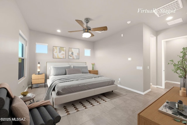 bedroom with baseboards, recessed lighting, and multiple windows