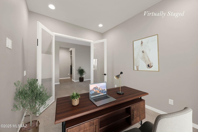 office space with baseboards