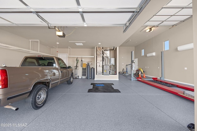 garage with an AC wall unit and a garage door opener